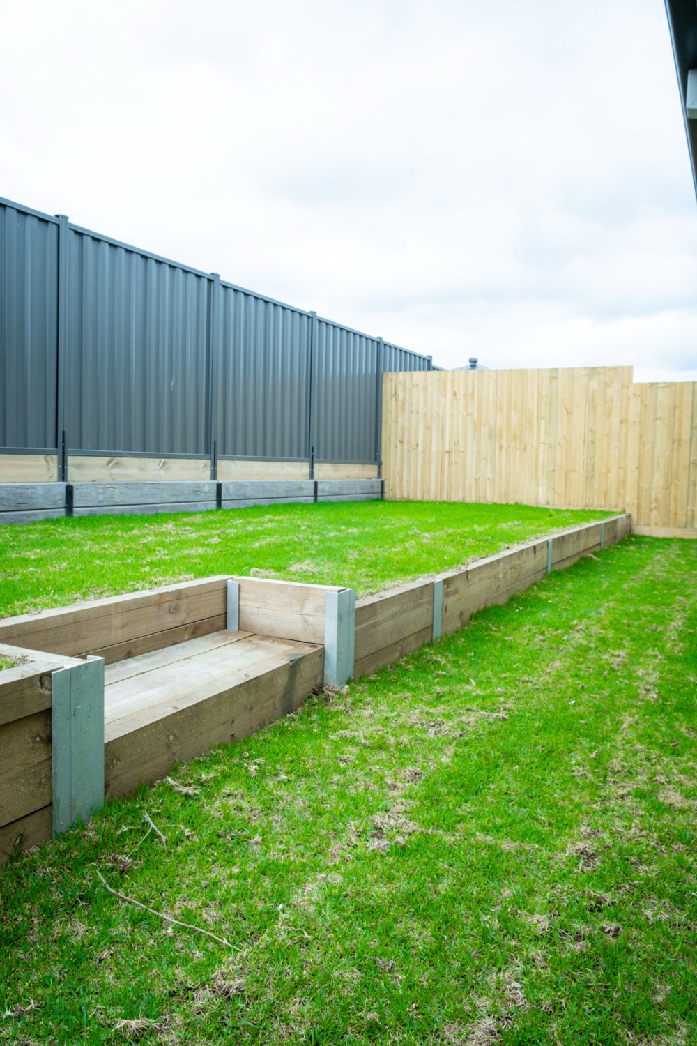 Colorbond fence with sleeper steps