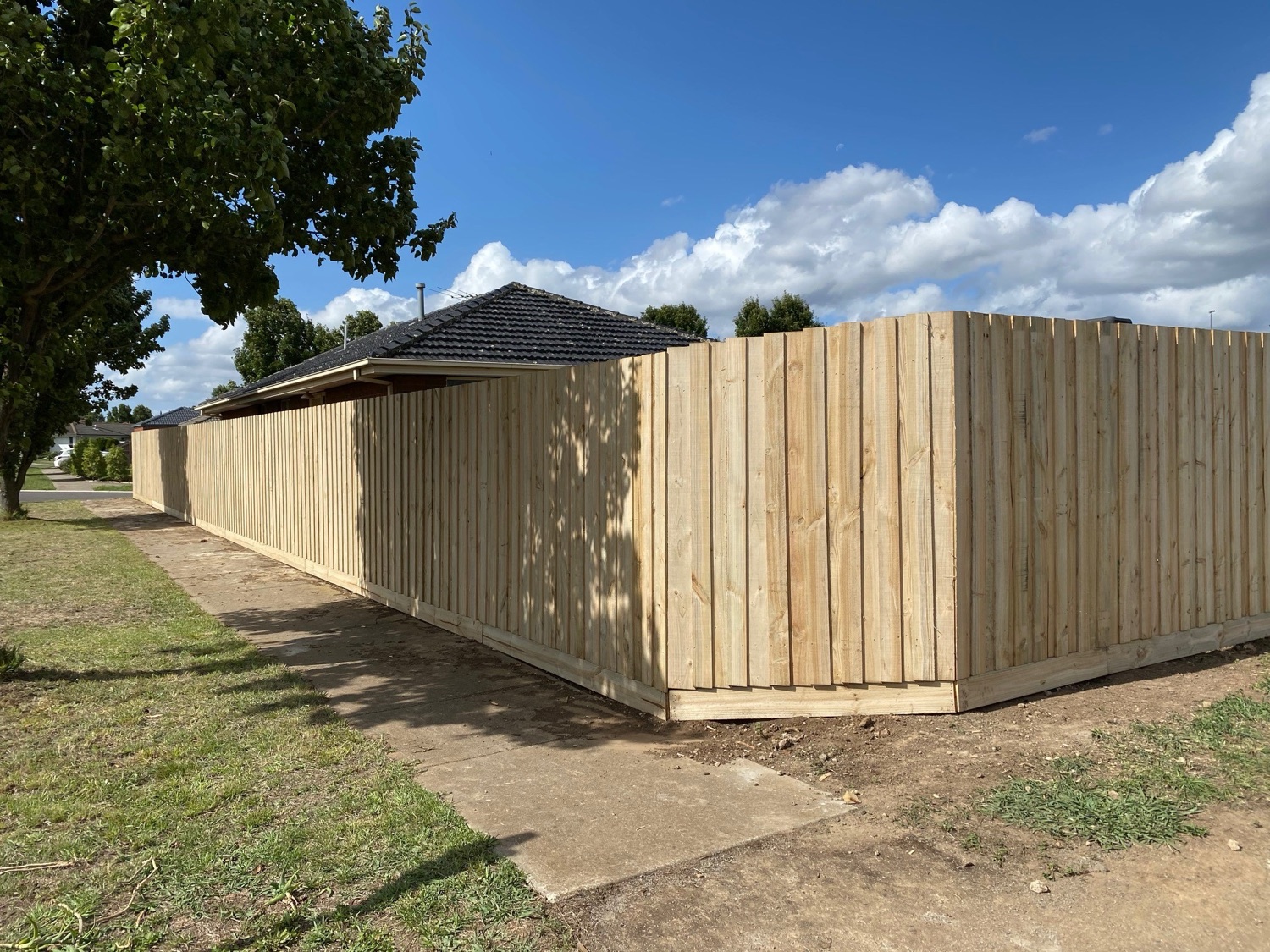 Timber fence wrapping a corner