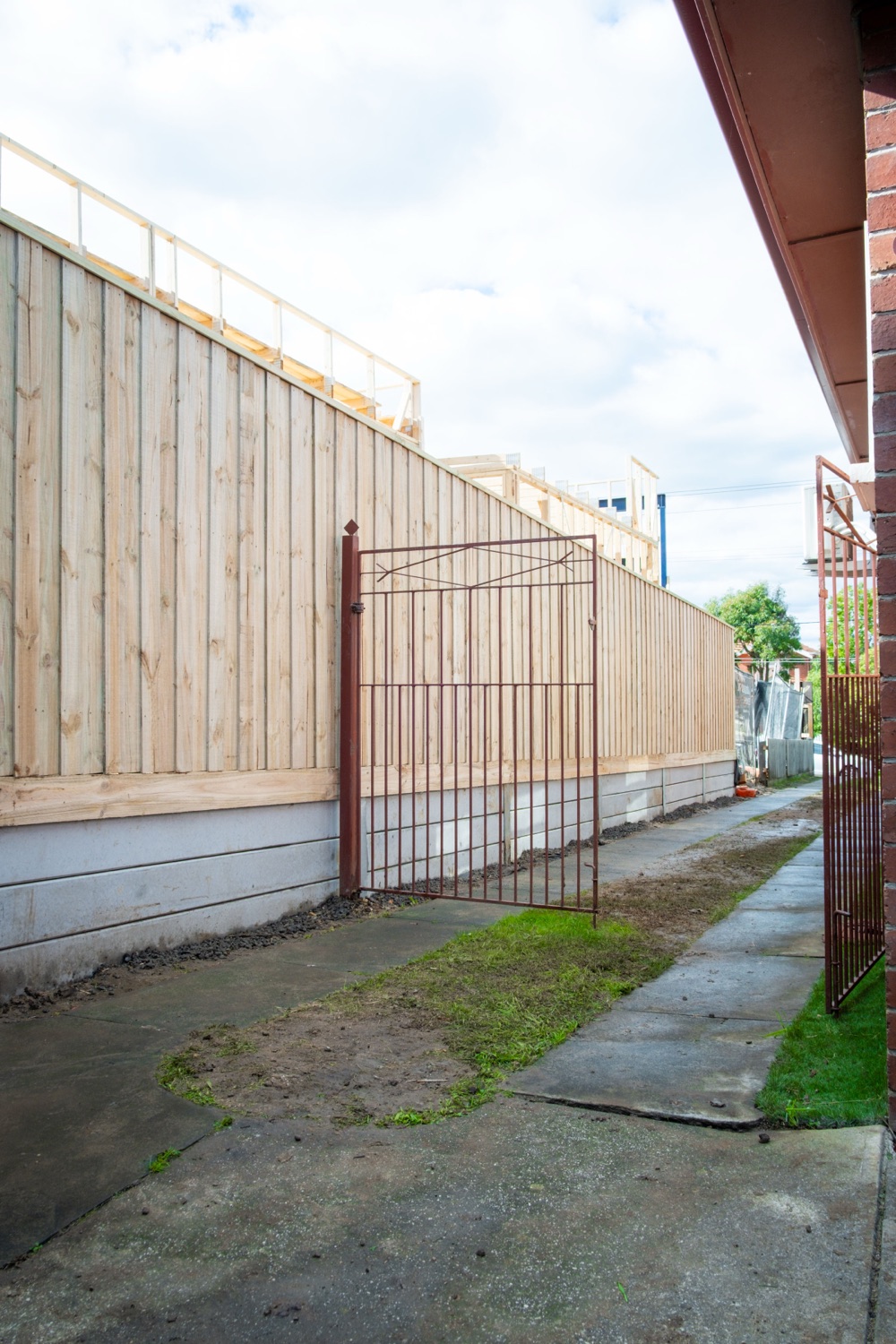 Timber fence with a custom gate