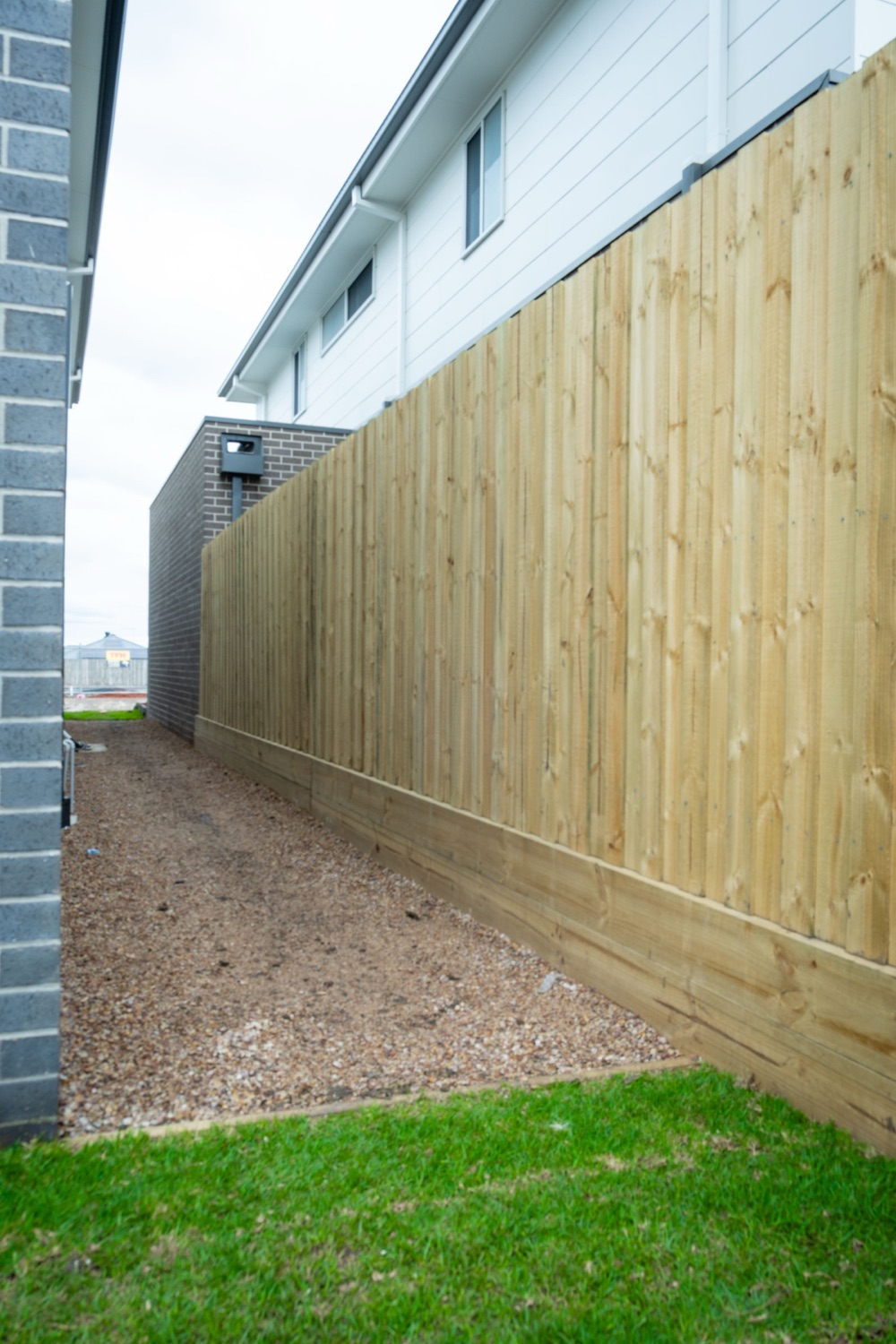 Natural timber paling fence